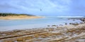 Seagull flying across the mouth of the Shoalhaven River mouth where it meets the ocean at Shoalhaven Heads, New South Wales, NSW,