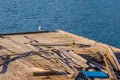 Seagull perched on the end of a floating pier Royalty Free Stock Photo