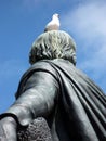 Seagull Perched on Head of Statue Royalty Free Stock Photo