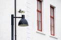 Seagull perched on a lamp post outside the school barracks of the historic Oscarsborg Fortress, Kaholmen Islands, Norway