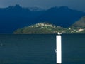 Seagull resting on the pole of the pier. Royalty Free Stock Photo