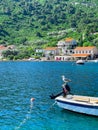 a seagull sits on the edge of a boat, adriatic Sea, Croatia Royalty Free Stock Photo