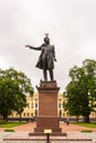 Seagull sits on the head of the monument to Alexander Pushkin on the square in front of the Russian Museum in St. Petersburg,