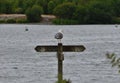 Seagull on fence post looking over pennington flash country park, photo taken in the UK mid summer Royalty Free Stock Photo
