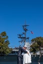 Seagull sitting on the hat of a sailor statue depicting Alfred Eisenstaedt`s famous picture of a U.S. Navy sailor as he