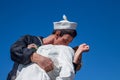 Seagull sitting on statue depicting Alfred Eisenstaedt`s picture of a U.S. Navy sailor passionately grabbing a passing woman