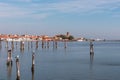 Sottomarina - Seagull sitting on wooden pole in Sottomarina, Veneto, Northern Italy, Europe. Panoramic view on idyllic harbor