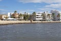 Seagulls in bay and BQ Aquamarina oceanfront hotel in strong winds