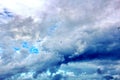 Seagulls and birds hovering in the sky against a background of white and colorful clouds and a coastline. Royalty Free Stock Photo