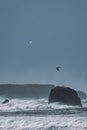 Seagulls fly over churning ocean during winter storm at the Oregon Coast. Royalty Free Stock Photo