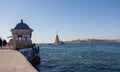 Seagulls flying in sky around the Maiden tower in Istanbul Royalty Free Stock Photo