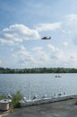 Seagulls, helicopters and Kayakers make up the Anacostia River scene, Washington, DC