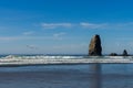 Seagulls over the ocean towards the vertical rocks that stand out in Cannon Beach, Oregon, USA. Royalty Free Stock Photo