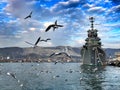 Seagulls in port of Novorossiysk near the ship of the cruiser Mikhail Kutuzov Royalty Free Stock Photo