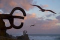 Seagulls and sculpture `Peine del Viento` in San Sebastian