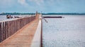 Seagulls sit on the railing of wooden bridge on Lesina lake, 22-km-long