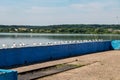 Seagulls are sitting on pier on shore of large lake