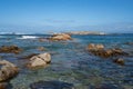 Seagulls on top of a rock on a wild beach in the north of Spain with Cies islands on the background in Galicia Royalty Free Stock Photo