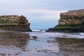 Seagulls on Top of Two Rock Formations on Sandy Beach