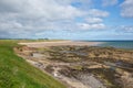 Seahouses beach Northumberland coast north east England UK with view to Bamburgh Castle Royalty Free Stock Photo