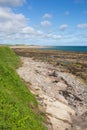 Seahouses beach Northumberland coast north east England UK with view to Bamburgh Castle Royalty Free Stock Photo