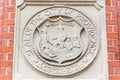 The seal of the City of Providence reproduced in stone on a brick pier of the Van Wickle Gates at Brown University in Providence,