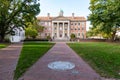 The seal on the University of North Carolina on brick walkway leading to the South Building