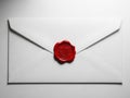Sealed white envelope with red wax seal on a plain background Royalty Free Stock Photo