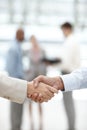 Sealing the deal. Cropped view of two businesspeople shaking hands. Royalty Free Stock Photo