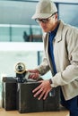 Sealing the last of his boxes for delivery. Shot of a delivery man sealing a box with tape. Royalty Free Stock Photo