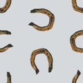 Sealmless background from watercolor drawings of old rusty horseshoes Royalty Free Stock Photo