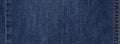 Seam blue denim cotton jeans fabric texture background Royalty Free Stock Photo