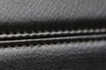 the seam at the junction of two pieces of black leather Royalty Free Stock Photo