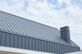 Seam metal roof with hidden eaves gutter Royalty Free Stock Photo