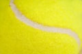 The seam of a yellow tennis ball