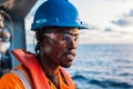 Seaman AB or Bosun on deck of vessel or ship , wearing PPE