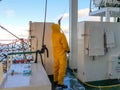 Seaman cleaning the ship. Royalty Free Stock Photo