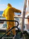 Seaman cleaning the ship. Royalty Free Stock Photo