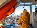 Seaman cleaning the ship. Royalty Free Stock Photo