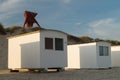 Beach cabins with seamark in sand dunes