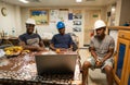 Seamen crew onboard a ship or vessel having fun watching movie Royalty Free Stock Photo