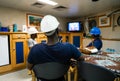 Seamen crew onboard a ship or vessel having fun watching TV Royalty Free Stock Photo