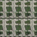Seamles pattern of concrete road tile on the green grass path Royalty Free Stock Photo