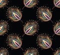 Seamless abstract feather pattern on black background