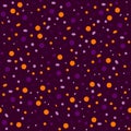 Seamless abstract pattern of circles of different sizes in a chaotic manner in the colors of Halloween Royalty Free Stock Photo