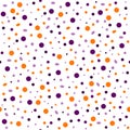 Seamless abstract pattern of circles of different sizes in a chaotic manner in the colors of Halloween on a white background Royalty Free Stock Photo