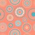 Seamless abstract pattern of circles and dots of orange and turquoise colors. Kaleidoscope background.