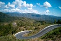 Seamless aerial view of cars driving on curved, zigzag curve road or street on mountain hill