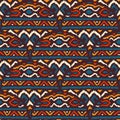 Seamless african pattern. Ethnic and tribal motifs. Orange, red, yellow, blue and black colors. Grunge texture. Vintage print for Royalty Free Stock Photo