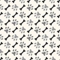 Seamless animal pattern of paw footprint and bone Royalty Free Stock Photo